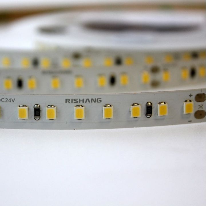 Світлодіодна стрічка RISHANG 3000K 12 Вт/м 2835 128 діодів IP20 24 Вольти 1800 lm тепле світло